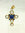 Croce in oro giallo con perle e lapislazzuli.